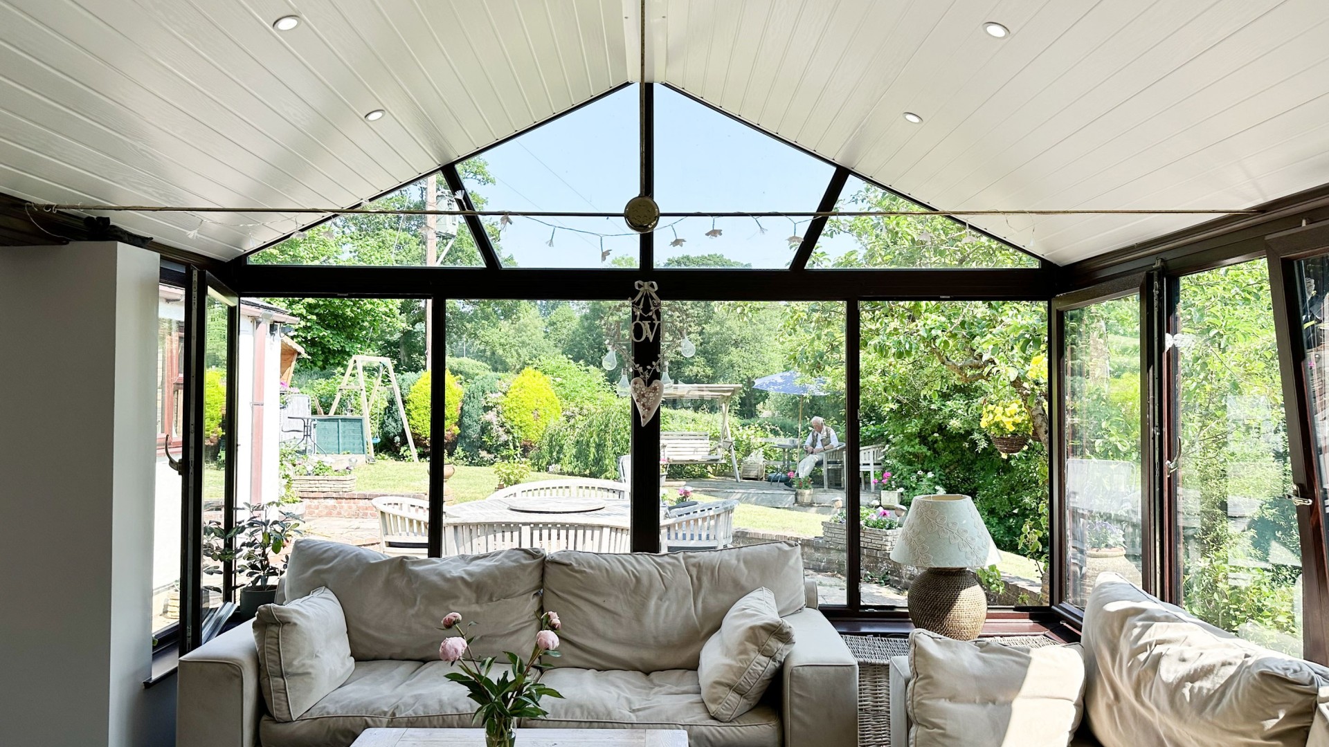 Conservatory fitted with CI Groups' insulation with a dining area and seating area